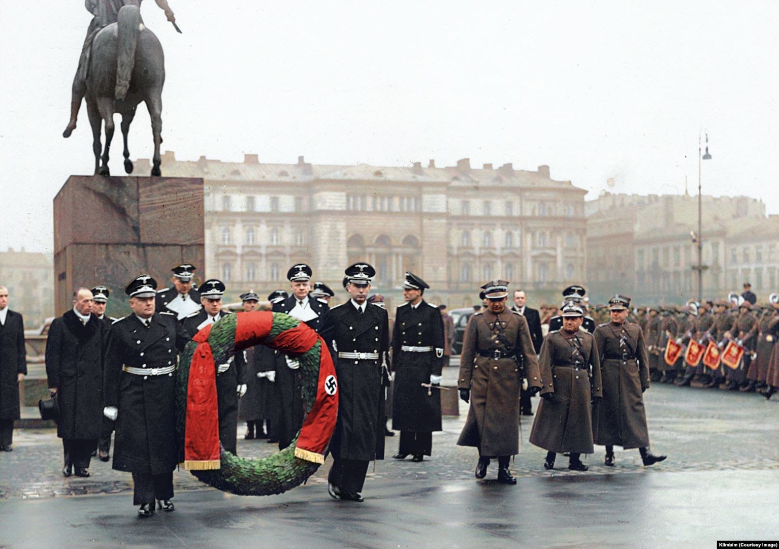 An image colorized by Olga Shirnina that was finished on May 26. The photo shows a wreath-laying ceremony in Warsaw in 1939, several months before Nazi Germany invaded Poland. This is one of three images Shirnina says would almost certainly result in a suspension of her account if she were to post it to Facebook.