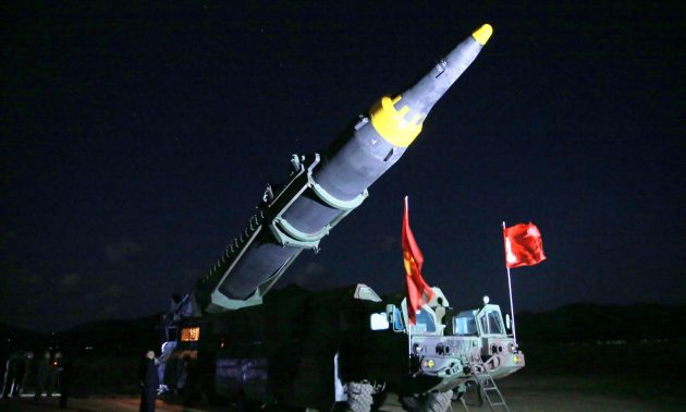 North Korean leader Kim Jong Un inspects the long-range strategic ballistic rocket Hwasong-12 (Mars-12) in this undated photo released by North Korea's Korean Central News Agency.