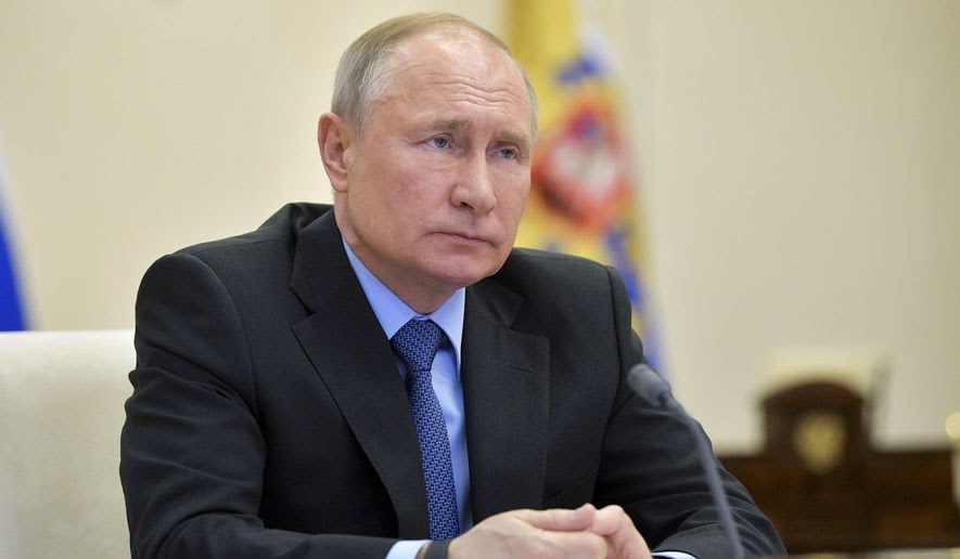 Russian President Vladimir Putin attends a meeting of the military technical cooperation with foreign countries via video conference at the Novo-Ogaryovo residence outside Moscow, Russia, Thursday, April 9, 2020. (Alexei Druzhinin, Sputnik, Kremlin Pool Photo via AP)